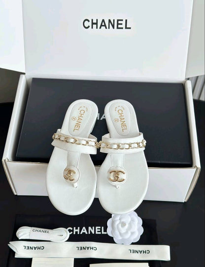 Luxury diamond-quilted flat slides with metal embellishments
