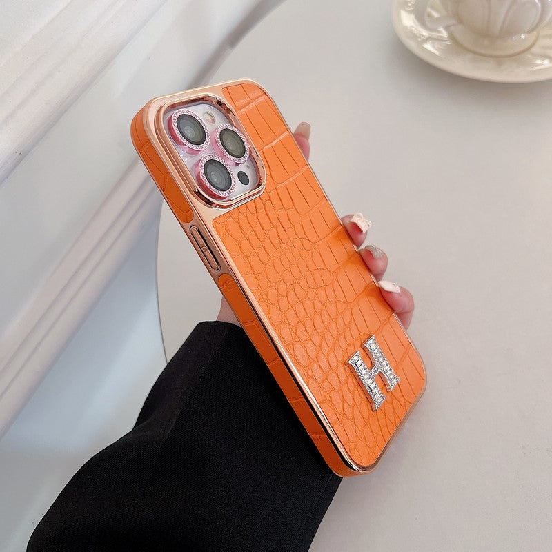 Klasyczne etui na iPhone'a z logo w kształcie diamentu w kolorze różowego złota